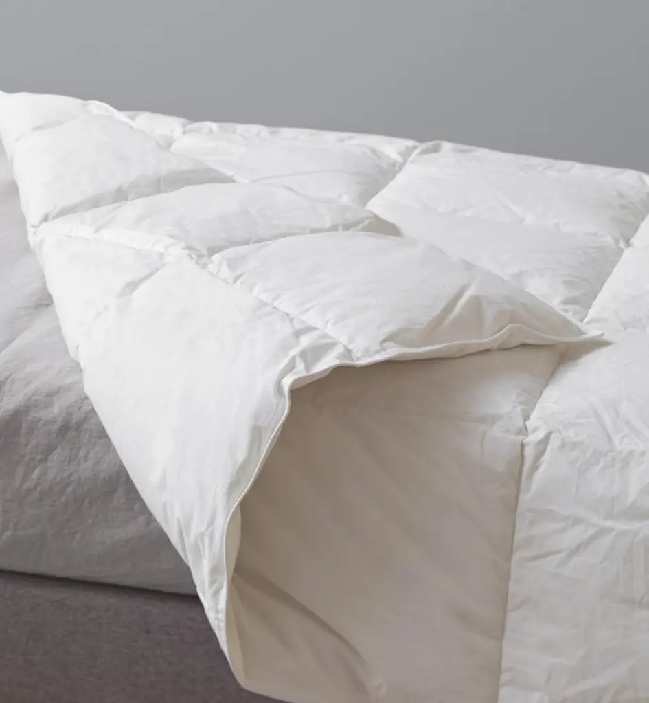 couette-enfant-lanai-en-duvet-et-plumes (2).webp